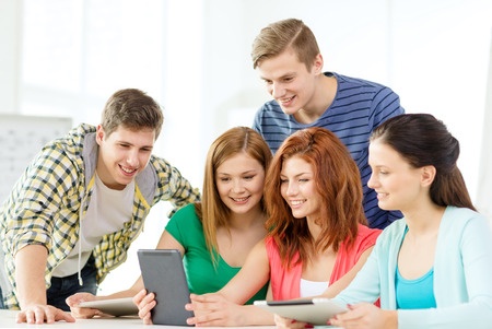 Teens around a computer